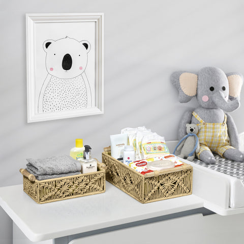 The Sorbus Macrame Basket Set is a stylish and practical solution for organizing nursery essentials. This set includes two small, rectangular baskets made from woven macrame material, designed to hold items like diapers, baby clothes, toys, and linens